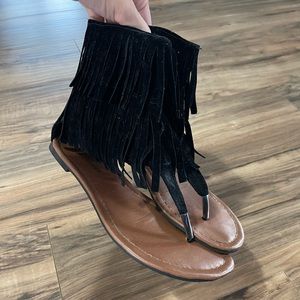 Flat flip flop sandals with tassels